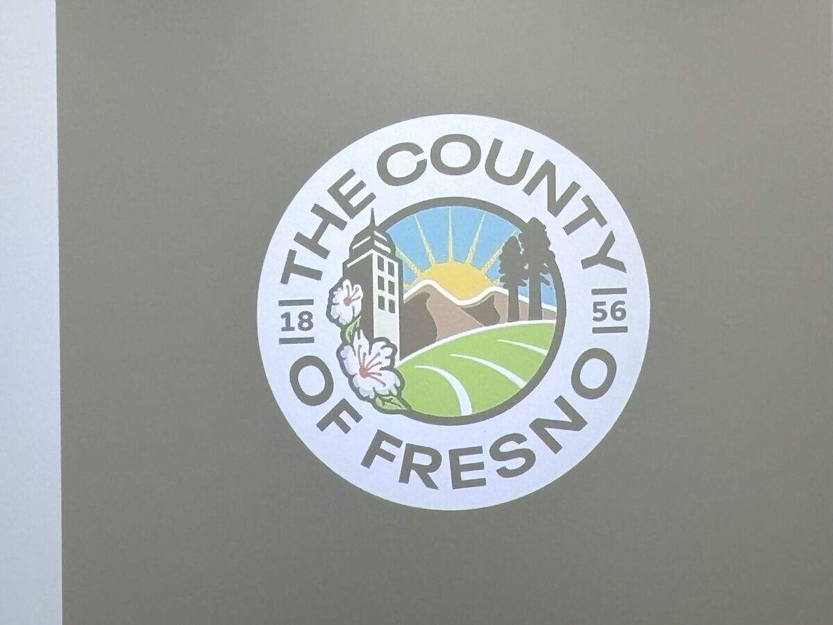 The new Fresno County logo projected on a screen before it was adopted Tuesday, Sept. 22, 2026, by the Board of Supervisors along with a new motto, “Farms to Forests, We Serve.”